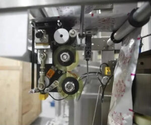 Деталь пакувальної машини для заднього ущільнення - принтер для кодування стрічки