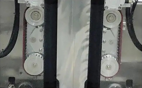 Деталь пакувальної машини з мішком із ластовицею - синхронізоване колесо для витягування мішка
